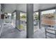 View of the outdoor porch and covered parking for the condo from the unit balcony at 1438 Millstream Ln # 201, Dunedin, FL 34698