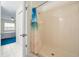Bathroom featuring a stand-up shower with a beach themed shower curtain at 1438 Millstream Ln # 201, Dunedin, FL 34698