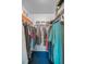Walk-in closet with shelves and hanging storage at 1438 Millstream Ln # 201, Dunedin, FL 34698