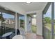 Screened porch with outdoor seating at 1438 Millstream Ln # 201, Dunedin, FL 34698