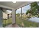 Screened porch with pond view at 1438 Millstream Ln # 201, Dunedin, FL 34698