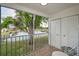 Screened porch with lake view at 1438 Millstream Ln # 201, Dunedin, FL 34698