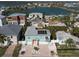 Aerial view of a charming coastal home with solar panels and proximity to a beautiful bay at 16109 3Rd E St, Redington Beach, FL 33708