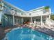 Inviting backyard pool with a spacious brick patio, ideal for outdoor enjoyment and entertaining at 16109 3Rd E St, Redington Beach, FL 33708