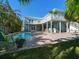 Backyard featuring a beautiful pool, lush tropical landscaping, spacious deck perfect for entertaining at 16109 3Rd E St, Redington Beach, FL 33708