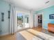 Bedroom with outdoor access to the balcony and views of the backyard at 16109 3Rd E St, Redington Beach, FL 33708