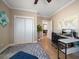 Bedroom featuring a desk, closet, and open doorway to another room at 16109 3Rd E St, Redington Beach, FL 33708