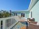 Wide view of the outdoor deck area with table and seating options at 16109 3Rd E St, Redington Beach, FL 33708