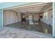 Open garage with epoxy floors, plenty of room and lighting, with curtains at 16109 3Rd E St, Redington Beach, FL 33708