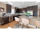Gourmet kitchen featuring granite countertops, stainless steel appliances, and a spacious island with seating at 16109 3Rd E St, Redington Beach, FL 33708