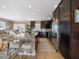 Spacious kitchen with dark wood cabinets, stainless steel appliances, granite counters and breakfast bar seating at 16109 3Rd E St, Redington Beach, FL 33708