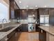 Modern kitchen features stainless steel appliances, granite countertops, and ample cabinet space at 16109 3Rd E St, Redington Beach, FL 33708