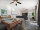 Basement living room area featuring a pool table and a large screen television at 16109 3Rd E St, Redington Beach, FL 33708