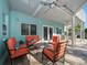 Charming outdoor patio with brick flooring, comfortable seating, and ceiling fans for relaxation at 16109 3Rd E St, Redington Beach, FL 33708