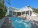 Inviting backyard pool with a spacious patio and lush landscaping, perfect for outdoor enjoyment at 16109 3Rd E St, Redington Beach, FL 33708