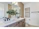 Modern bathroom featuring double sinks, spacious counter, and decorative accents at 1672 Valier Pt, Zephyrhills, FL 33541