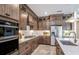 Modern kitchen with stainless steel appliances and a central island at 1672 Valier Pt, Zephyrhills, FL 33541