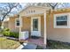 Close-up of front entrance featuring a decorative door and well-kept landscaping at 1796 Harbor Dr, Clearwater, FL 33755