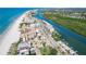 An aerial view showcases the community's prime coastal location, situated near the beach, intercoastal, and surrounding neighborhood at 18399 Gulf Blvd # 389, Indian Shores, FL 33785