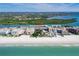 An aerial view highlights the community's beachfront location, proximity to the beach, and desirable coastal lifestyle at 18399 Gulf Blvd # 389, Indian Shores, FL 33785