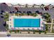 Beautiful aerial view of the community pool with parking, landscaping, and plenty of seating at 18399 Gulf Blvd # 389, Indian Shores, FL 33785