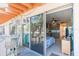 Relaxing balcony with chairs, tables, and sliding glass doors to interior at 18399 Gulf Blvd # 389, Indian Shores, FL 33785
