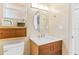 Bathroom features modern vanity, sink, countertop, mirror, and tiled walls at 18399 Gulf Blvd # 389, Indian Shores, FL 33785