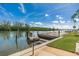 A dock area that has a grill that is sitting near the water at 18399 Gulf Blvd # 389, Indian Shores, FL 33785