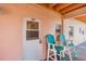 Exterior view of a condo unit with colorful chairs on the patio at 18399 Gulf Blvd # 389, Indian Shores, FL 33785
