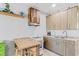 Well-equipped kitchenette with cabinets, sink, oven, and small dining table at 18399 Gulf Blvd # 389, Indian Shores, FL 33785