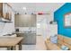 Efficient kitchenette features modern appliances and a comfortable futon, perfect for a compact living space at 18399 Gulf Blvd # 389, Indian Shores, FL 33785