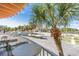Relaxing view from the balcony with trees, road, and buildings at 18399 Gulf Blvd # 389, Indian Shores, FL 33785