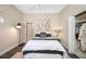 Comfortable bedroom offering a closet and stylish decorations in neutral tones at 19005 Cour Ests, Lutz, FL 33558