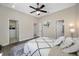 Spacious bedroom featuring a walk-in closet, modern decor, and an adjacent bathroom at 19005 Cour Ests, Lutz, FL 33558