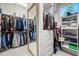 Well-organized closet with ample hanging space, shelving, and a full-length mirror at 19005 Cour Ests, Lutz, FL 33558