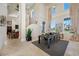 Elegant dining room featuring high ceilings, large windows, and a stylish table setting at 19005 Cour Ests, Lutz, FL 33558