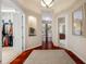 Hallway with access to a walk-in closet, living spaces, and primary bathroom at 19005 Cour Ests, Lutz, FL 33558