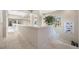 Bright hallway with marble floors, a staircase, and a view to the outside at 19005 Cour Ests, Lutz, FL 33558