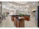 Gourmet kitchen offers dark cabinets, granite countertops, and an open layout for entertaining at 19005 Cour Ests, Lutz, FL 33558