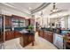 Spacious kitchen features custom wood cabinets, granite countertops, and stainless steel appliances at 19005 Cour Ests, Lutz, FL 33558