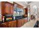 Charming kitchen with granite counters, wood cabinets, and a view to the backyard at 19005 Cour Ests, Lutz, FL 33558