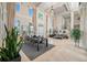 Elegant living room with high ceilings and large windows creating a grand and inviting space at 19005 Cour Ests, Lutz, FL 33558