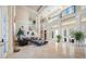 Expansive living room with high ceilings and large tile floors at 19005 Cour Ests, Lutz, FL 33558
