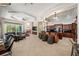 Open living space features a combined gourmet kitchen, breakfast bar, and welcoming Gathering room at 19005 Cour Ests, Lutz, FL 33558