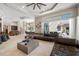 Bright living room with a seamless indoor-outdoor flow to the covered lanai at 19005 Cour Ests, Lutz, FL 33558