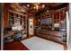 Wood-paneled office with built-in bookshelves, desk, and decorative ceiling and trim at 19005 Cour Ests, Lutz, FL 33558