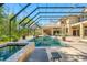 Relaxing backyard pool area with spa, lounge chairs, and screened enclosure for outdoor enjoyment at 19005 Cour Ests, Lutz, FL 33558