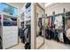 Spacious walk-in closet with custom shelving and ample storage at 19005 Cour Ests, Lutz, FL 33558