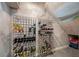 Climate-controlled wine cellar with custom storage racks, perfect for wine enthusiasts at 19005 Cour Ests, Lutz, FL 33558