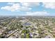 Aerial view showcases the neighborhood with lush greenery, homes, and streets at 1901 66Th N Ave, St Petersburg, FL 33702